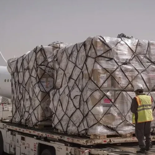 cargo-loading-airport-with-airplane-workers_1222783-11466